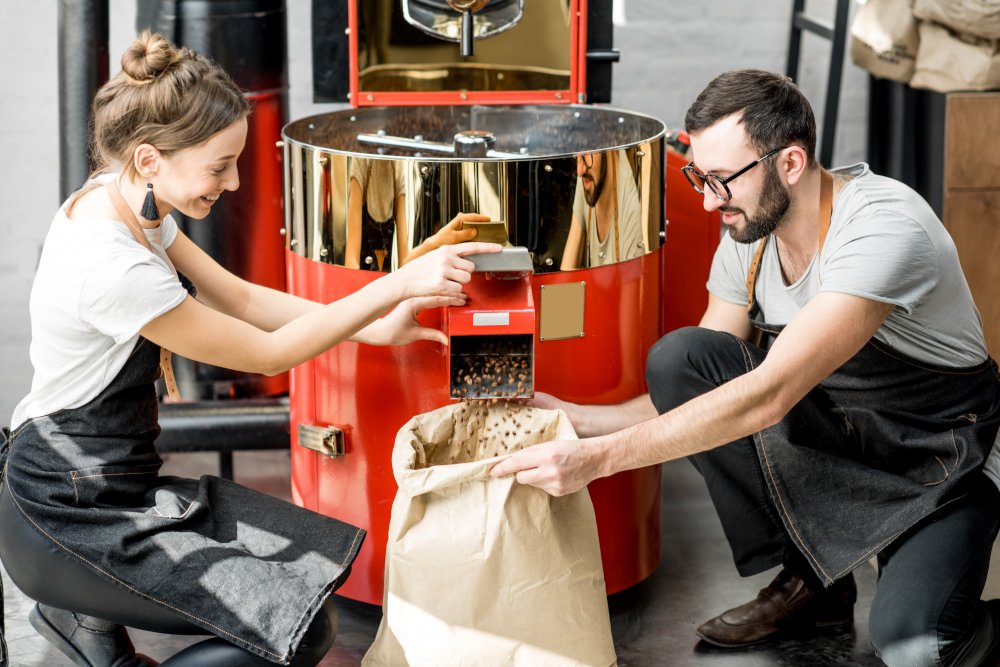 Pouring roasted coffee beans from the machine food fraud
